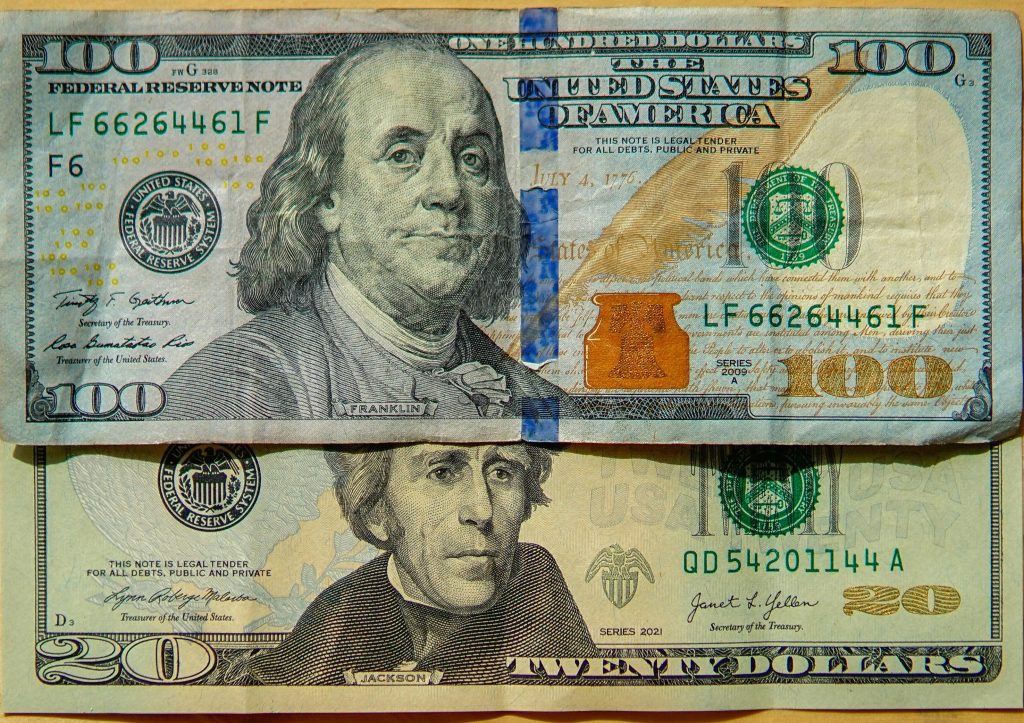 100 dollar bill and a 20 dollar bill
